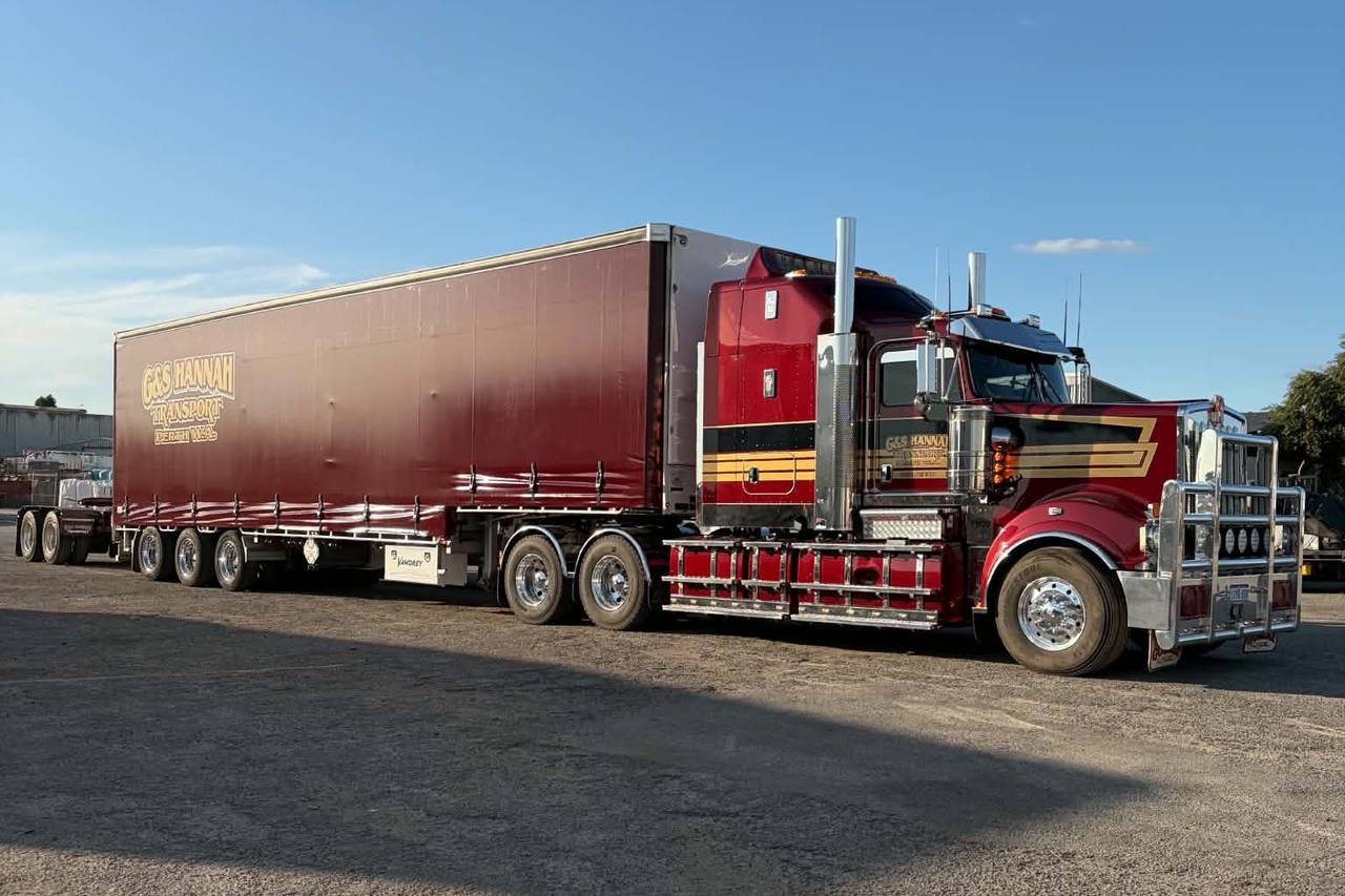 G&S Hannah Transport Kenworth and Tautliner trailer with a fresh set of maroon curtains, ahead of a run to Brisbane.